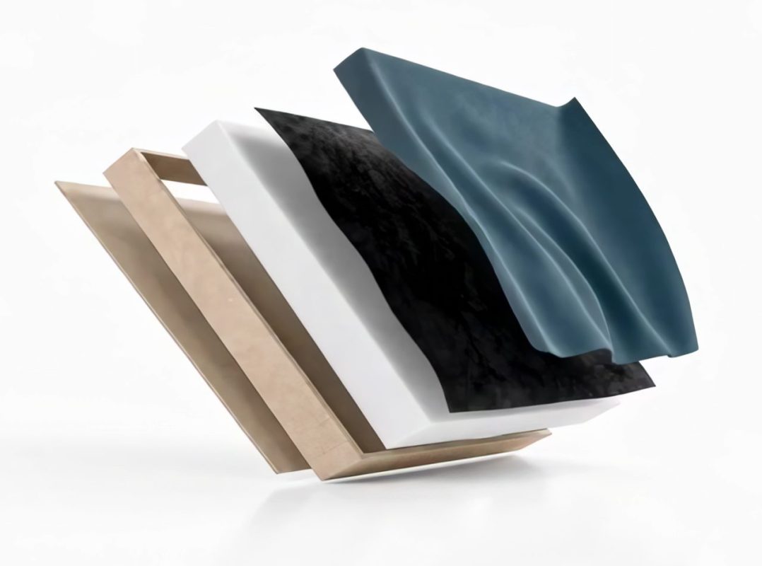 The Absorber Premium's four layers spread out in the air: the HDF frame, wool, black non-woven fabric, fabric