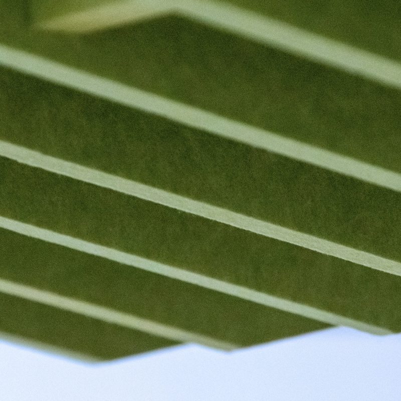 The tiles' geometric pattern above a conference table