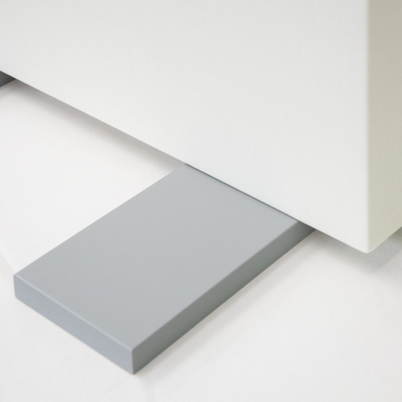 A detail of the Premium fabric, the back board and the feet